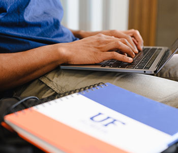 close up of a notebook with UF Logo