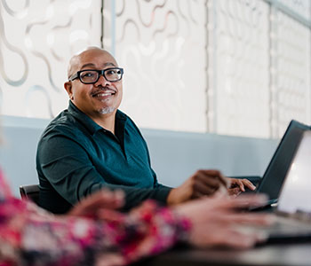 A person seated at a computer in the Career Connection Center