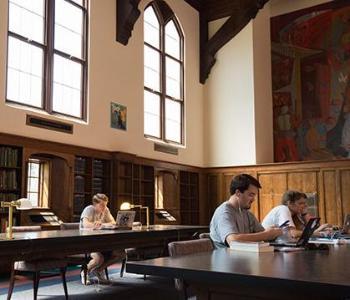 Students working at desks in historic Smathers Library